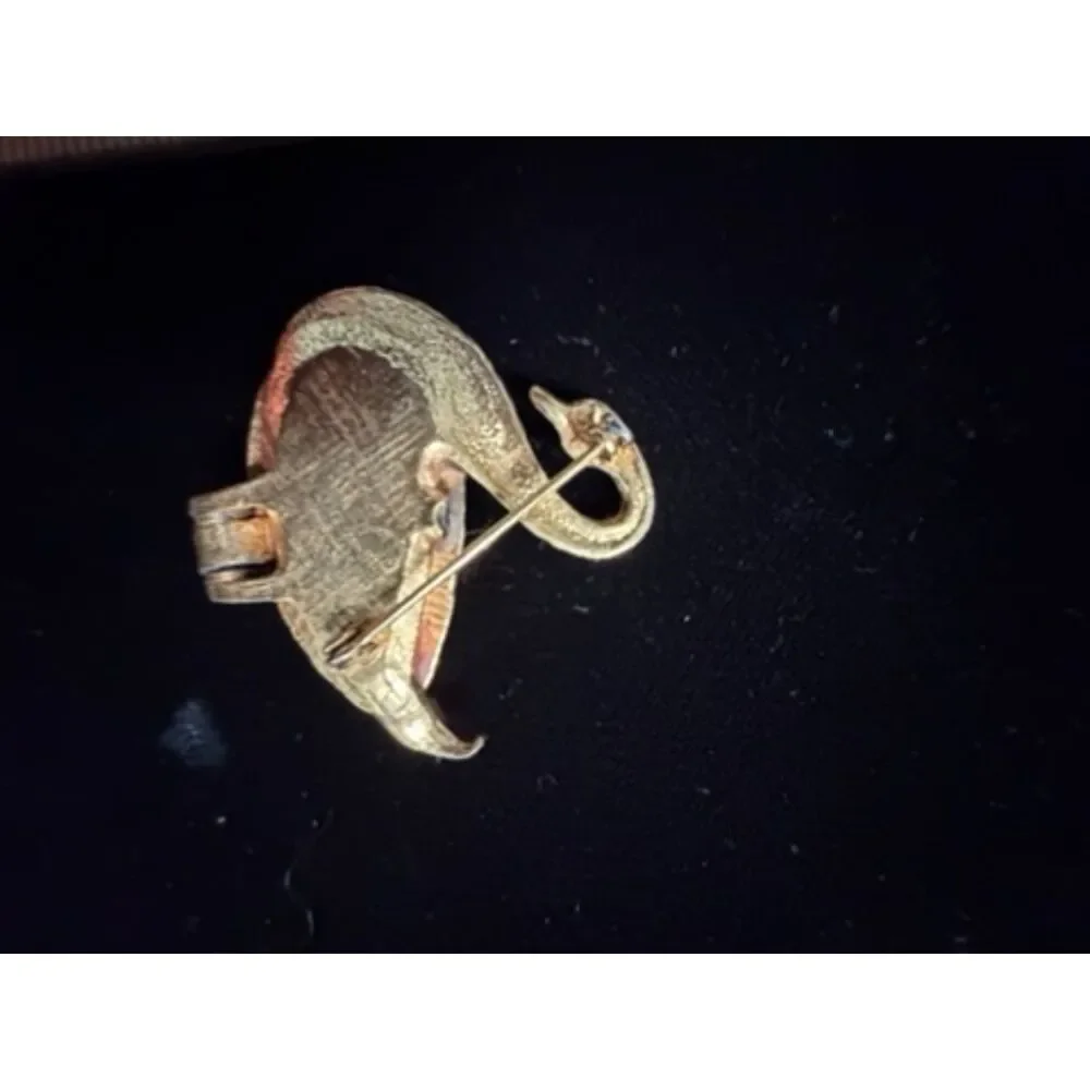 vtg.  Gold toned Swan Brooch/locket with Green Rhinestone eyes and opens up to